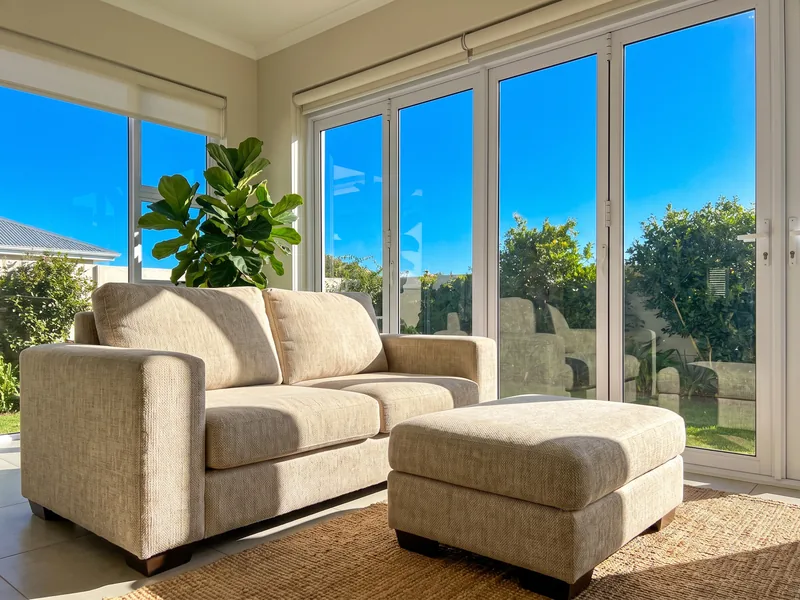 Clean light fabric sofa in a bright living room